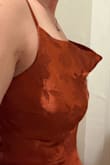 Suuuper weird neckline. Gappy and odd. From the pictures, I thought it was a scoop neck, but it's floppy? Idk what to do with this. I tried tucking it in, but it doesn't stay. The slit opens in the front?? Several odd design choices. Also the straps have a thousand loose threads and look so cheap. I'm so sad I tried it on late and missed my return window. - Karolyn C.