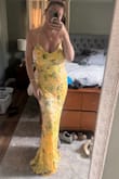 Didn't end up wearing this because it was a little fancy for my needs but the dress is beautiful and fit well. I have a larger bust but the adjustable ties in the back made it so no bra is needed. It's lined well and the sequin details don't show any nips if you go braless. Dress was a little long for my 5'7 height and I would've needed platform heels or taller heels. Hemming is probably doable, but more than the cost of the dress. - Sarah W.