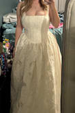 It fits true to size based on the measurement chart!! I'm a 32H, so I was nervous, but it fit really nicely!! I needed help zipping it, but it was pretty simple. The only thing I need to alter is the length, but that's just due to my height = it's a candle white, so not exactly a true bright white or an off white, but I think it's so gorg. She snatches you, too! 10/10 recommend and would buy again! - Olivia L.