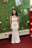 Such a beautiful dress. I ordered this for my wedding in May, and I've gotten so many compliments from my family, and even the seamstress when I went to get it hemmed a little shorter! I did buy an xs at first since it was a little too big but ended up exchanging for an xxs, and it fits SO GOOD!!!! (Also, I did buy shapewear, but it does show in the back so if you're planning on wearing shapewear, I recommend buying one that won't show in the back.) - Loreyne M.