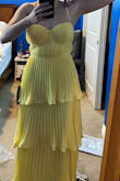 I love it, but I don't know how to fix the material under the armpit. It kinda sticks out a little weirdly. I will take it to a tailor and see what they can do because seriously, the rest of the dress is soooooo pretty. I love how flowy it is and perfect for a summer formal wedding. Maybe I'll just keep my arms down lol - Rachel F.