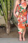 Fits nicely. Flattering on a curvy body. Not as much teal as the advertised picture shows - mostly orange/pink. Really happy with my purchase. - Lauren G.