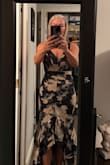 I had my eye on this dress for quite sometime, but not a big fan of ruffles or flowers. I'm a little more simplistic. I saw that it was on sale for $44 from $110, so thought what do I have to lose? It is a little snug around the ribcage as others have said, but not enough to be uncomfortable. Also being short, it is too long even with the heels. I am having it shortened. Can't wait to wear it, even though it's out my comfort zone, it's really a beautiful dress. - Juneeta F.
