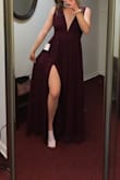 I got this dress for my prom and it is beautiful! The burgundy is more of a wine color than red but it's still very cute. It runs very long so I had mine taken in and I had the straps taken in too but even with the cost of the alterations and the dress together it was under $200 which was my price range. I recommend this dress it's super simple and flowy. - Morgan D.
