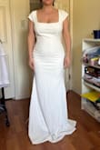 I love this dress, it's everything I was hoping for. The cap sleeves are so elegant, and the square neckline is beautiful. The material is thick and has some stretch (crepe material is what I was looking for), so it sits nicely on the body. The online size finder & chart said to get a size S, based on my info, but ladies, this dress fits very small. I've bought about 5 other Lulus dresses to try on, and this fits more like the small (not a medium). I'm glad I bought both S and M because my wedding elopement is in a couple of weeks. I sent it to be shortened, but no other alterations are needed. - Tara A.