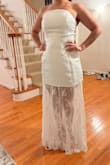 I had to refund it because it was very long and the actual dress it is high, not even able to dance and move without showing much. I would say very loose and long - Ximena L.