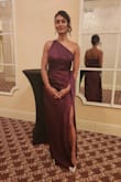 Very flattering dress. The straps are adjustable. The slit length is appropriate enough for formal events. - Proma D.