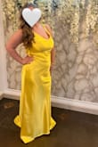 I love this dress so much. I had my eye on it for my step-sister's black tie wedding. I had to put my name on a waitlist for my size to come in. When it did, I immediately bought it. It fit beautifully. I'm only 5" and I ordered a large because I'm curvy. I was worried about the length, but it wasn't too bad with heels. It probably would've been a little better if I brought it to get the length fixed, but it didn't bother me especially because it's supposed to have a little train. I probably could've gotten away with a medium, but I didn't want the fit to be too tight. The only problem with the large was I had to keep pulling the straps up since it's backless. But again, that didn't bother me. For the girlies with big breasts, I wear a 34ddd so I used boob tape. My first picture is with heels, the second is without. - Alyssa D.