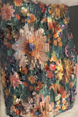 Colors are very dark and it's predominantly  green. The photo makes the dress appear as if it's muted. I am returning. - April R.