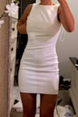 I got this for my graduation, it is the perfect balance of professional from the front and hot from the back. Super cute! Not see through at all, stretchy, great material! - Lily F.