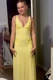 We purchased this for a family wedding for my 15 year old daughter. The xtra small ran a little snug but she wanted it to be fitted. It's a beautiful lemon yellow and a very flattering cut. The diamond shaped panels of lace with sequin detail add a more formal feel. - Jennifer K.