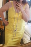 I always wear black as it's my go-to colour. But the moment I saw this 'How to Lose a Guy in 10 Days' dress, I fell in love with it. I'm 1.78cm, and my weight fluctuates between sizes EU 40 and 44. So to be safe, I went for the XL. The size wasn't available, so I subscribed to the notification, and as soon as I received it, I immediately purchased the dress.

When it arrived in Spain, my husband and I were pleasantly surprised by the quality of the fabric and the uniqueness of the colour and fabric movement. I have body dysmorphia, so I didn't want to try it immediately, and even then, my husband told me: Even if you go with another dress, let's keep this one because it's special. 

I tried the dress on a few days before the wedding in the UK, and it fit perfectly. I wore some spandex underneath for a smoother fitting, but the dress is forgiving. The straps also ran a bit large, but nothing too bad.

Five women wore yellow to the event, but I received numerous compliments and felt like a star - MarÃ­a D.