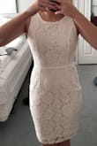 The material was great, a little see through but not cheap. The beads on the back seem a little fragile and so be careful when slipping it on and off. - Shannan R.