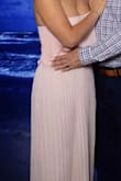 My only complaint about this dress is that it is not made for the bustier women. I was constantly having to pull it up and there was no room for a bra. There is a strip to help keep it up but, it wasn't much help. I still wore the dress and got a ton of compliments on it. - Sarah C.