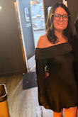 I ordered both a medium and a large to figure out the best fit. I liked the medium for the snug neckline, but with my curves, the back ended up being a little too short. The large gave me the extra length I needed, and the neckline was still really flattering. The dress is slimming, and the lining helps it lay beautifully. I wore this to a friend's formal/cocktail birthday party, and it was the perfect mix of flirty and flattering. - Mary H.