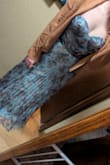Love the dress! It looks exactly as the photos show, and I took in everyone else's advice and sized up. I'm kind of in between a medium and a large right now, so the large fits great! Length will be perfect for heels. - Kelsi M.