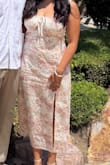The dress is beautiful in person, and I received many compliments while wearing it. I don't know why somebody said it was itchy. The dress is lines and flattering, although it does run small. I usually wear a Large, and I had to size up to an XL. - Ximena Z.