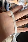 The strap was flawed straight out of the packaging. Almost deteriorated. The zipper gets stuck on a bump. It's a shame because it is beautiful, and the actual fabric is good quality. However, these details make a big difference in quality and how I feel during graduation. - Margarita F.