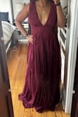Very beautiful color dress!! It is darker than the picture though. The straps down to the breast area are a little wide and make me look bulky. It is very long even with heels (I'm 5'4). It has a lot of fabric in the skirt so it's going to be too hot for the event I'm going to. - Sarah W.