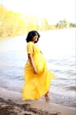 I wore this dress for my Maternity Photoshoot and absolutely loved it! How it wraps around was a blessing! It was comfortable to wear, it was light! The only issue I had was the slip underneath, it was a bit short but at least it covered my butt! ;-) - Tyffani N.
