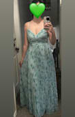I purchased the dress as it fit the color-scheme of the wedding I'm attending and reminded me of the gorgeous Dreaming In Color dress. This dress has the same pleated details, padded cups (no bra needed!), and an adjustable tie in the back to make the bodice area fit as desired. This dress is a different fabric and has a lining under the skirt, but it is just as beautiful and comfortable. This also wasn't as long, so I won't need to hem this! I got a medium and felt that it fit true to size and fit well. I'm so excited to wear this dress! - Alexis Y.