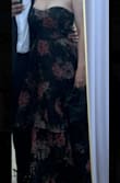 What a beautiful dress. It fit a little loose, but I wouldn't go down a size. I just had it tailored. I think a size down would've been too small. It was the right floor length & it fit comfortably, and it looked amazing for a formal outdoor wedding. Material was lightweight, and the print was lovely. - Carolyn F.