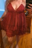 I really want to love this. I love the material.  I love the ruffles. I love everything about it.  
Except how it looks on me. I loved it so much and kept trying to decide whether to keep this one or not. In the end,  I think i realized it would be prettier in my closet than it would on me.  Nothing was helping it make my chest look any better,  specifically. 
I didn't realize the return window wasn't 30 days and unfortunately missed the cutoff  because of this dress specifically, since I couldn't decide whether to return this one or not and wanted to do them all at the same time.  :-( 
Hopefully it fits better on your body than mine. - Susan B.