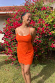 This dress is darling! It's tighter in the waist, which I love. The material is nice and not irritating. If you have larger bust size up. I'm 34DDD and got a M. - Leah Y.