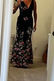 Dress is beautiful in person. Long enough for my height. Not stretchy but fits great! Love the flowers embossed on dress. Can't wait for wedding to wear it.
The original one I purchased had tear in the side but was immediately sent replacement and it's just as beautiful. - Erin D.