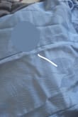I ordered this for prom, and the texture is certainly different than the picture. It came with a more ruffled fabric not at all the smooth silky fabric displaced. It also is a much darker blue than the baby blue I was expecting. Its cute but not for prom. - Mazelle J.