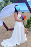 I loved my dress, and so did the groom and our guests. My wedding was at the beach, so it was the perfect dress to flow with the Spring breeze. 

It was comfortable, easy to wear (with some help with the zipper), and the back straps had their trick, yet it was a beautiful back. The slit in the skirt was sexy, but not revealing.  

I was in love with this dress, but in order to add an extra touch, I added beading and rhinestones in the waistline, which matched with my headdress. - Nitzaira D.