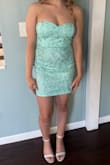 The dress fit perfectly, and the length was just right, not too short, but still very classy. Delivery was fast, which was a huge plus. It does look a little different in person compared to the photos, but it's still absolutely beautiful. - Colleen W.