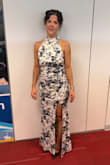 This dress was everything I hoped for. Comfortable because of the stretch, sexy with the high slit and low back, flattering with the halter neck line and ruching, and stunning with the white/black floral design and velvet. I received SO many compliments on the dress and how amazing I looked in it. At my height, it required no hemming, I just grabbed a slightly higher heel than I already owned to ensure it wouldn't drag. I was sitting for hours at my event and was never uncomfortable. - Gillian L.
