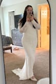 I sized up to XL due to other reviews saying sleeves were tight. It was also a bit too long in the front, but I was able to get it altered, and it fits like a glove. Second pic was before alterations. - Evelin V.