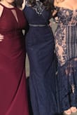 The material is quaility and the dress fit true to size. May want to size up if you have a larger bust. - Amanda L.