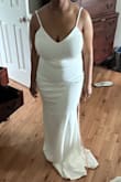 I am 5'0 and wear a 32I bra size. The large fit me really well, and it was the first dress I felt confident to wear, even without shapewear! Look really good on. Cute and simple. I decided I don't want spaghetti straps because of my shoulders. - Amber J.