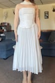I love the dress design and it fits great (sized up from medium to large and that was a good move) but the hem is uneven, and the top is crooked. Also, the skirt of the dress is definitely see through. - Sarah R.