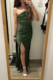 The dress is just like on stock photos, the olive green colour is beautiful in real life also. Too long for my height, but the heels will help it. It has two layers of fabric, on the outside: satin, on the inside: also polyester, but more skin-friendly, this makes the dress really comfortable. - AdÃ©l A.