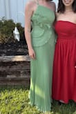 The dress was perfect! I was shocked to find out that I didn't need to wear a bra (that never happens). The zipper is little tough to move, and the small straps do dig into your skin just a little (like after hours of wear), but those are my only small complaints. Everything else is great! - Abbi R.