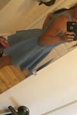 This dress fits perfectly! I had two babies back to back and I have a serious pooch. This dress is so flattering! The material and the shape are so forgiving. I felt so pretty and confident in it! It's my favorite. I ordered it in red and periwinkle. - Gabrielle D.