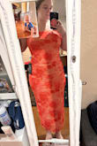 Fits like a glove! Fits your curves without showing my back rolls and stomach. It has ruffled layers, so it doesn't overly show everything. It has an elastic at the top so it doesn't slide down. My busty girls, you have to wear a bra, tape them, or a strapless bra, because it's not tight enough to secure the girls. Sizes: 5'8 210lbs 36G - Grace Z.