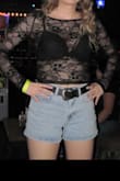 I purchased this fun top for a night out and loved it! I wore a black bra underneath, and it worked great. For reference, I am 5'4" and 128 lbs. This shirt is very comfy and has some stretch to it, so you don't have to be worried about the lace easily tearing. I just drip dried it in the dryer and it is in perfect shape for another night out! - Brenna P.