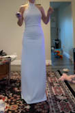 Absolutely loved it. It fits like a glove. Super elegant. The shipping was super quick. The only thing was that I wish it was padded. The top runs a little big too but I'm also small in that area. I'm 5'5 and have long legs and the length was perfect. The fabric is pretty thick too so it's not see through which is definitely a bonus! I was extremely impressed especially for the price. - Lacy D.