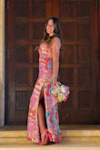 This dress is simply gorgeous! Colorful and cheerful! It is stretchy, so it seemed to run a bit large. I originally ordered size S, but I returned it. XS fit me very well and did not need to be hemmed with 3heels. Coordinated well with all the friends in the photos!! Unique look while also super classy. I got TONS of compliments! - Maya C.