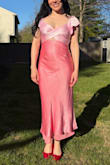 I've been buying dresses from Lulu's for years, and this dress is an all-time favorite! The satiny fabrics are gorgeous and drape beautifully.
The dress felt true to size but definitely does not have any stretch, so you'll want to make sure to check your measurements (I ordered a small and a medium and ended up keeping the small). The shoulder straps are elastic, and the open back has a tie that creates a little bit more of a custom fit up top. While you do need to iron or steam this dress before wearing it, it is absolutely 100% worth it. It's surprisingly one of the most COMFORTABLE dresses I've ever owned. I felt gorgeous, and at the end of a very long and active day of wearing it to host a party. I still didn't want to take it off. I'm already trying to find another event to wear it again! - Angelica S.