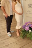 I used this for my baby shower and it was perfect! I am 5'4 and about 7 mo pregnant, and it hit me mid to low calf. The liner did slip up a bit on my bump but to be expected. It was pretty stretchy too, so I think you could size down if you see between sizes. I ordered a medium and it fit perfect. - Elisabeth E.