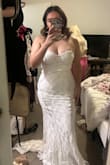 Love this dress, and pictures really don't do it justice. It looks like it is from a bridal boutique. It does run on the tighter side. I'm 159, and it's pretty tight. - Marissa G.