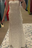 If you are even thinking about trying this dress, just order it! Maybe you won't like it, but maybe you WILL, and it will end up being your wedding dress (or your dress for another occasion). Something about this dress just made me feel so special. At first, the puffy sleeves were my favorite part, but after I got the dress altered and had the sleeves made detachable, I actually think I might prefer how it looks on me without sleeves. I am including a picture of the train to show how gorgeous it is, but I also added a bustle where I can easily pin it up, and it still looks gorgeous. I ordered a size small, and although it felt snug on top, because I am smaller chested, I had to get it altered to be tighter, along with adding padding for a bra. I also got the dress shortened as I am 5'4''. Because I am smaller chested, even with it being tightened around my chest, I think I will have to occasionally pull up the dress throughout the day when I wear it, but I am still so happy with it. Thank you, Lulus! - SARAH M.