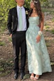 Bought this for my daughter's prom and it's so beautiful, great color, and the sheen of the design on the fabric is so pretty, but it was too long. We had to have it hemmed 4 inches and also took in the straps. The adjustable part does not work, so if you are ok spending $75 on extra alterations, it will become incredible - Valerie O.