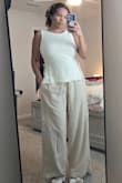Love the feel, texture, and fit of this top. You can adjust the side ties depending on how much skin you want to show. I tried it on with a lot of different bottoms and it went well with all of them! - Kiara R.